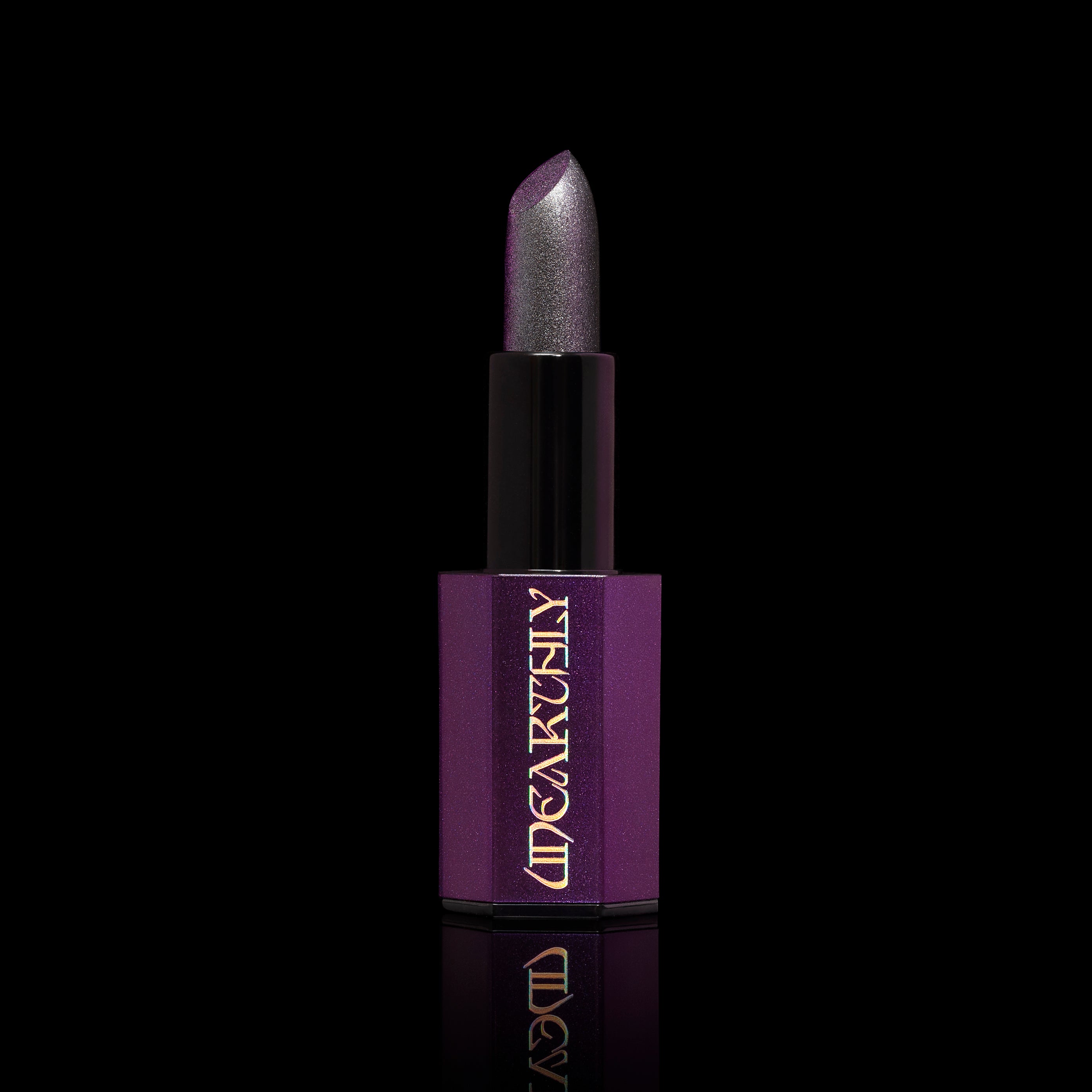 Silver lipstick goth lipstick on black background