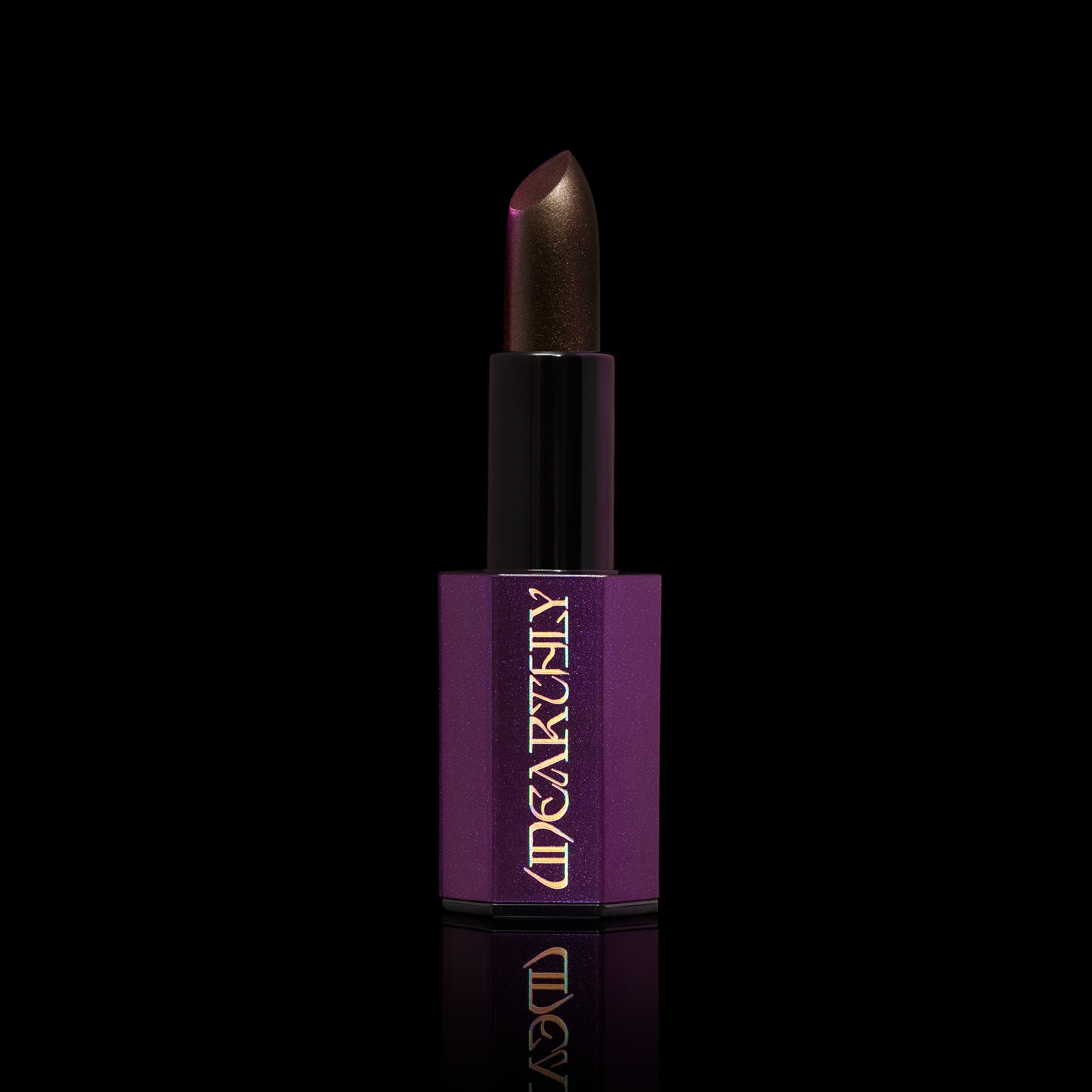 Bronze lipstick on black background 